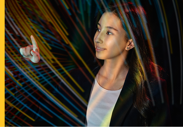 A woman points while overlaid with streams of colored light.